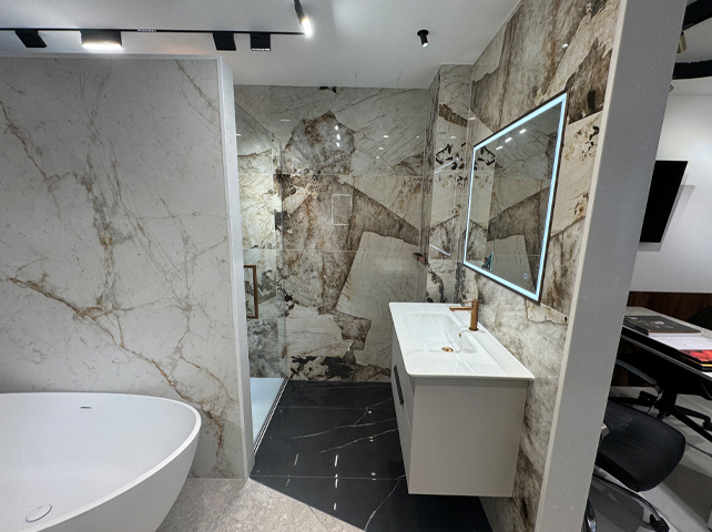 Marble bathroom with white sink and big mirror